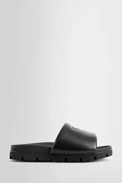 Prada Padded Nappa Leather Slides In Black