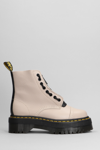 DR. MARTENS' SINCLAIR COMBAT BOOTS IN TAUPE LEATHER