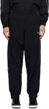 Nike Solo Swoosh Water Repellent Track Pants In Black/white