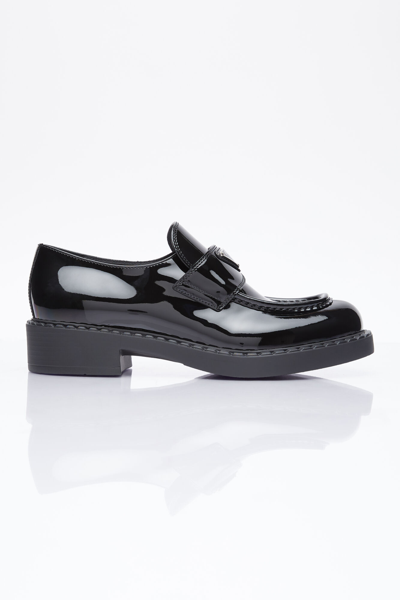 Prada Logo Plaque Loafers In Black