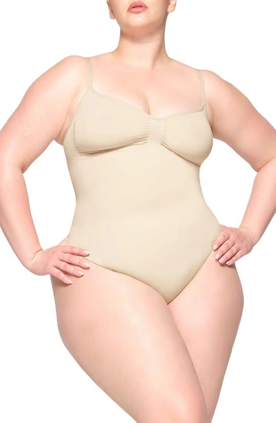 Skims Seamless Sculpt Thong Bodysuit In Sand