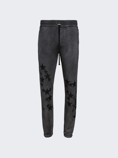 AMIRI PIGMENT SPRAY STAR SWEATPANTS