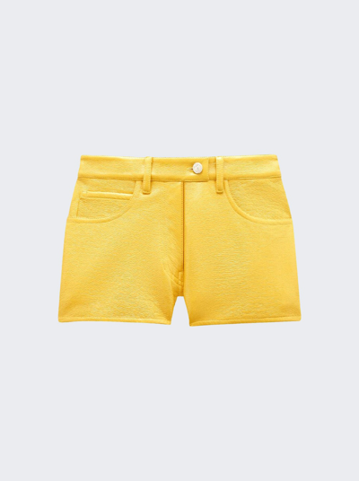 Courrã¨ges Coated Stretch Mini Shorts In Ochre
