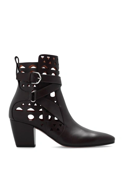 Alaïa Cutout Leather Buckle Ankle Boots In Brown