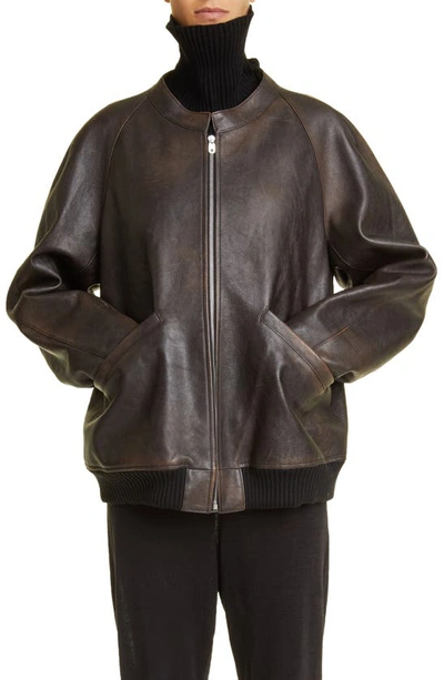 The Row Kengia Distressed Leather Bomber Jacket In Brown