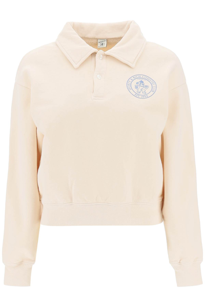 Sporty And Rich Lion Crest Brand-print Cotton Polo Shirt In Beige