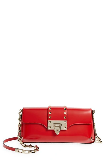 Valentino Garavani Rockstud Small Leather Clutch Bag In Red