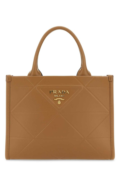 Prada Symbole Logo Printed Mini Top Handle Bag In Beige