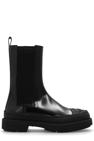 Gucci Gg Debossed Ankle Boots In Black