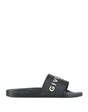 Givenchy Logo Embossed Rubber Slides In Black