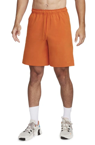 Nike Dri-fit Unlimited 7-inch Unlined Athletic Shorts In Orange