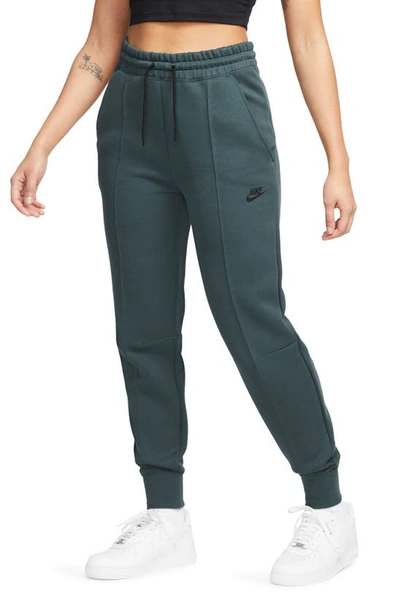 Nike Women's  Sportswear Tech Fleece Mid-rise Jogger Trousers In Green