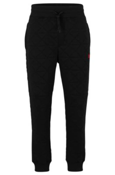 Hugo Boss Relaxed-fit Cotton Tracksuit Bottoms With Handwritten Logo In Black