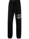 Amiri Logo Printed Drawstring Sweatpants In Black