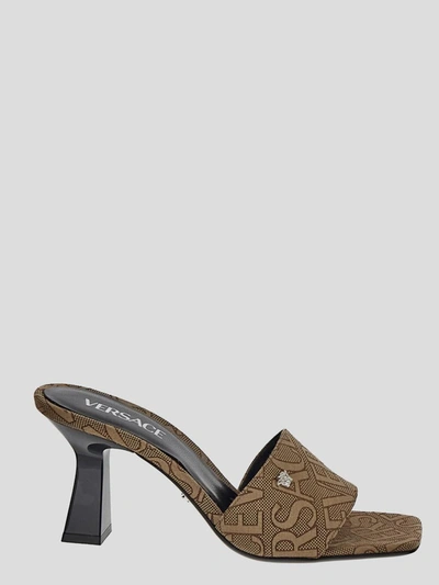 Versace Embellished Logo-jacquard Canvas Mules In Brown