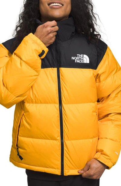 The North Face 1996 Retro Nuptse 700 Fill Power Down Packable Jacket In Summit Gold/ Tnf Black
