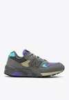 NEW BALANCE 580 LOW-TOP SNEAKERS IN SHADOW GRAY AND ELECTRIC INDIGO