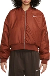 Nike Sportswear Reversible Faux Fur Bomber Jacket In Orange/guava