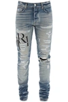 AMIRI AMIRI DESTROYED JEANS WITH STAGGERED LOGO