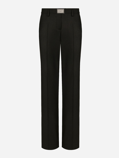 Dolce & Gabbana Flared Wool Trousers With Logo Tag In Black