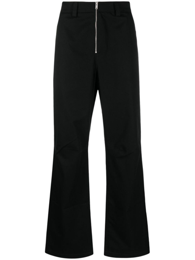 Ambush Logo Embroidered Zip Up Trousers In Black
