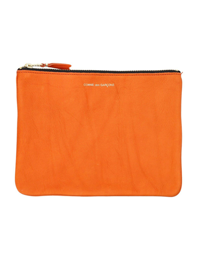 Comme Des Garçons Logo Printed Zip-up Pouch In Burnt Orange