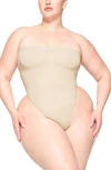 Skims Seamless Sculpt Strapless Bodysuit In Sand
