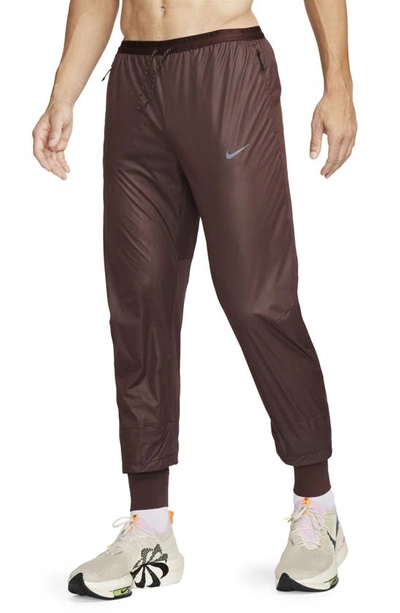 Nike Running Division Storm-fit Phenom Water Resistant Pants In Earth