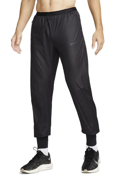 Nike Running Division Storm-fit Phenom Water Resistant Pants In Black