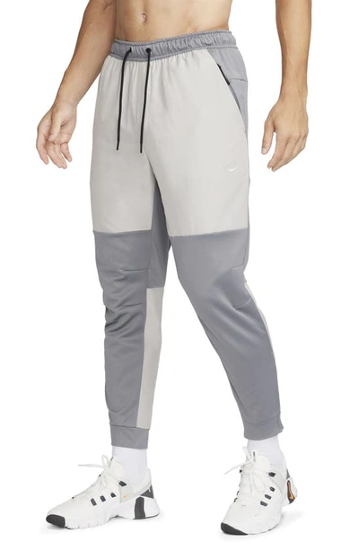 Nike Men's Unlimited Water-repellent Zippered Cuff Versatile Pants In Grey