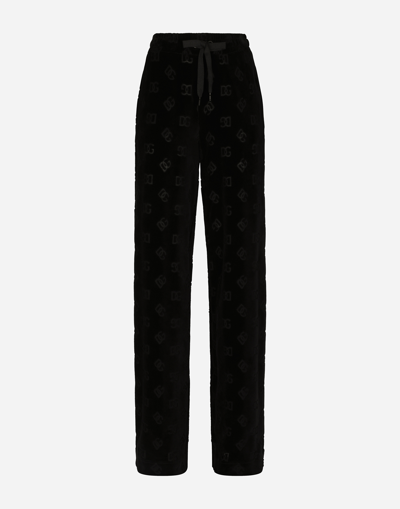 Dolce & Gabbana Flocked Jersey Pants With All-over Dg Logo