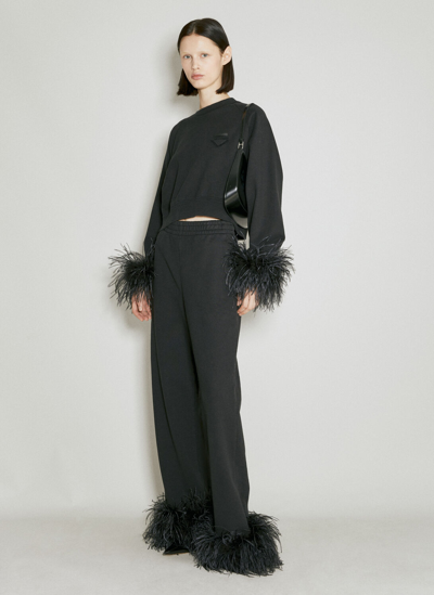 PRADA FEATHER CUFFS TRACK PANTS