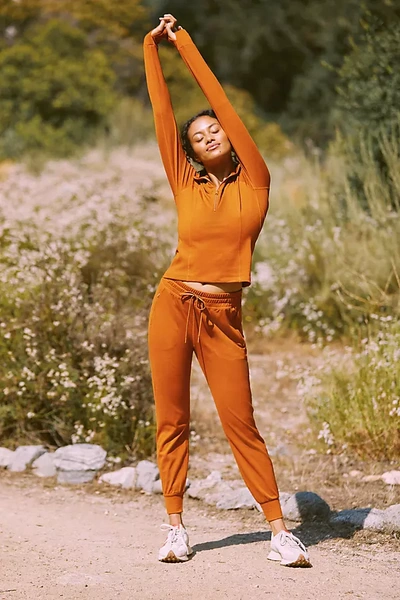Beyond Yoga Caught In The Midi Space-dye High-waisted Legging In Orange
