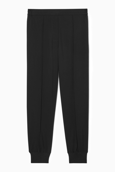 Cos Pintucked Elasticated Tailored Joggers In Black