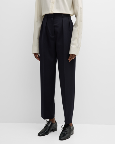 The Row Corby Pleated Tapered Wool Pants In Black