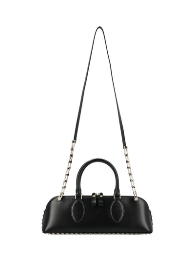 Valentino Garavani Handbags. In Black