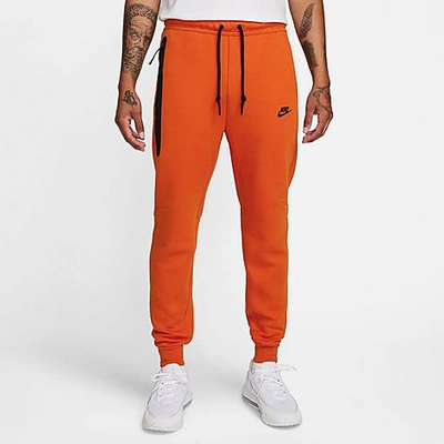 Nike Tech Fleece Joggers In Black/orange