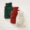 AURA QUE TAMASI CABLE KNIT HOT WATER BOTTLE COVER.