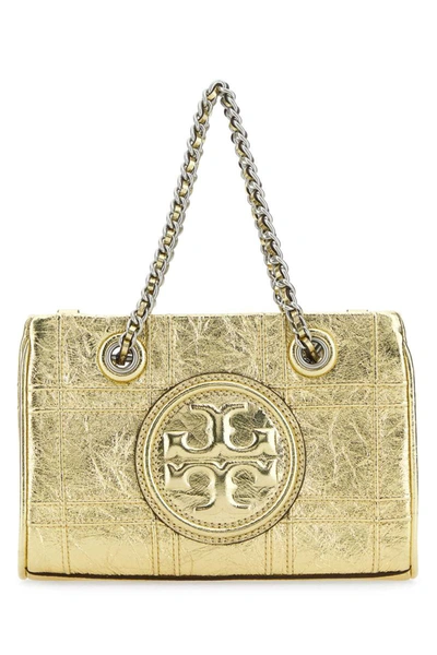 Tory Burch Handbags. In Gold