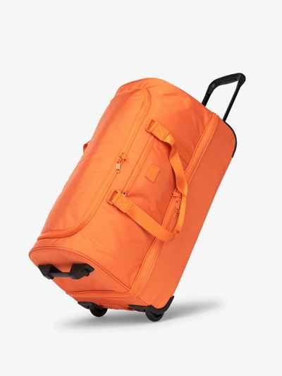 Calpak Stevyn Large Rolling Duffel In Orange ModeSens