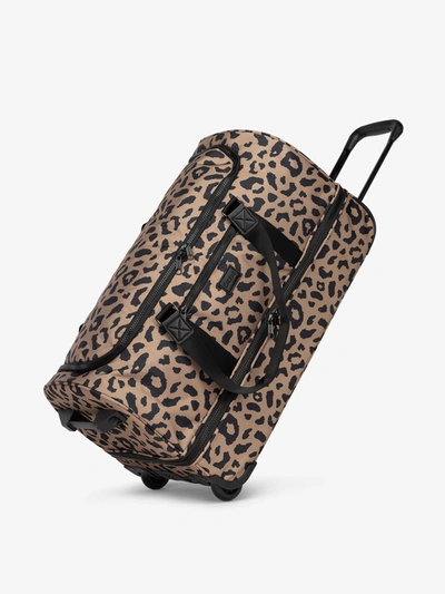 Calpak Stevyn Large Rolling Duffel In Cheetah