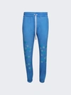 Amiri Pigment Spray Stars Sweatpants In Blue