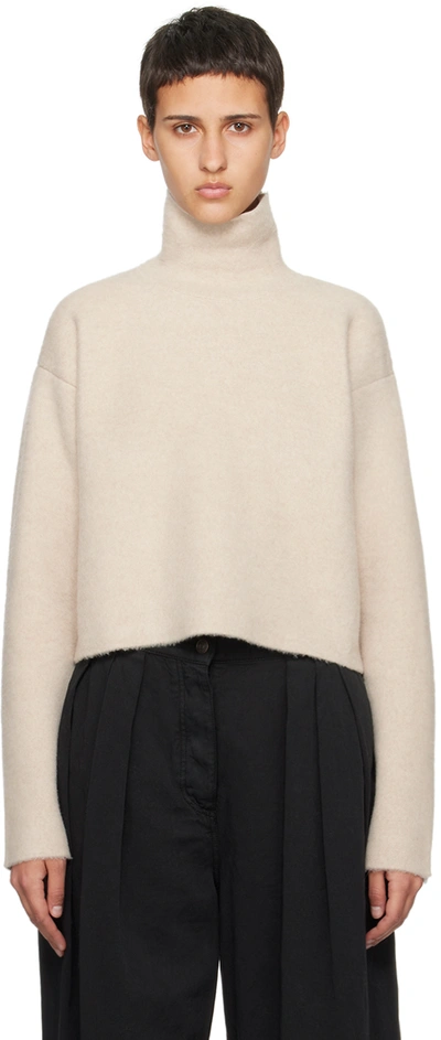 The Row Erise Oversized Brushed Merino Wool Turtleneck Sweater In Beige