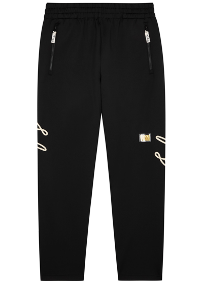 Advisory Board Crystals Logo-embroidered Stretch-jersey Track Trousers In Black