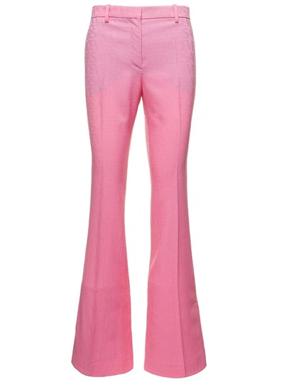 VERSACE PINK FLARE PANTS WITH TONAL LOGO LETTERING IN WOOL
