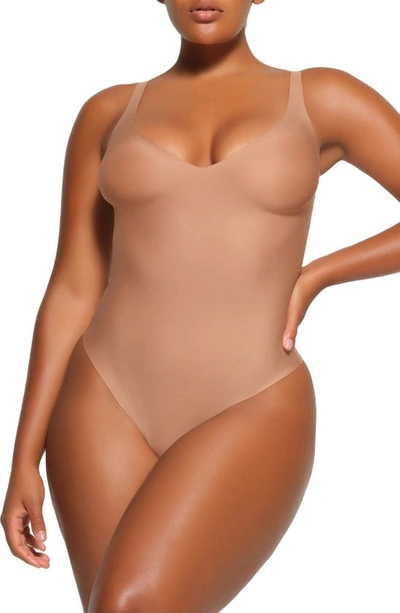 Skims Body Basics Plunge Thong Shaper Bodysuit In Sienna