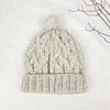 AURA QUE COSY CABLE KNIT WOOL BOBBLE HAT