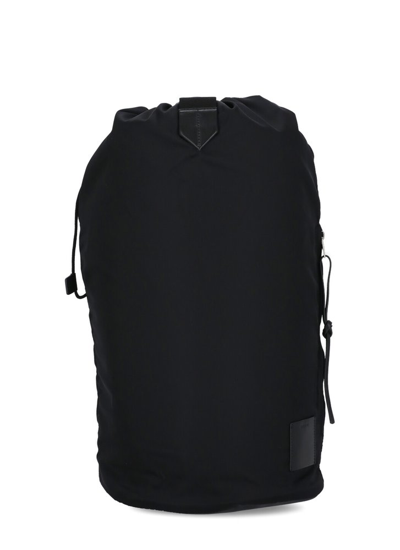 Jil Sander Logo Embossed Drawstring Backpack In Black