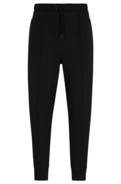 Hugo Boss Tracksuit Bottoms With Pixelated Details In Black