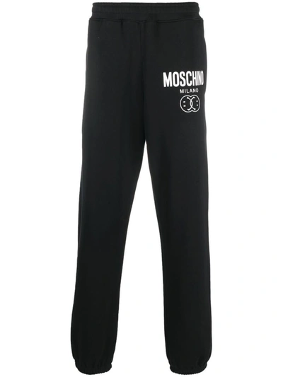 Moschino Logo Printed Tapered Track Pants In Black